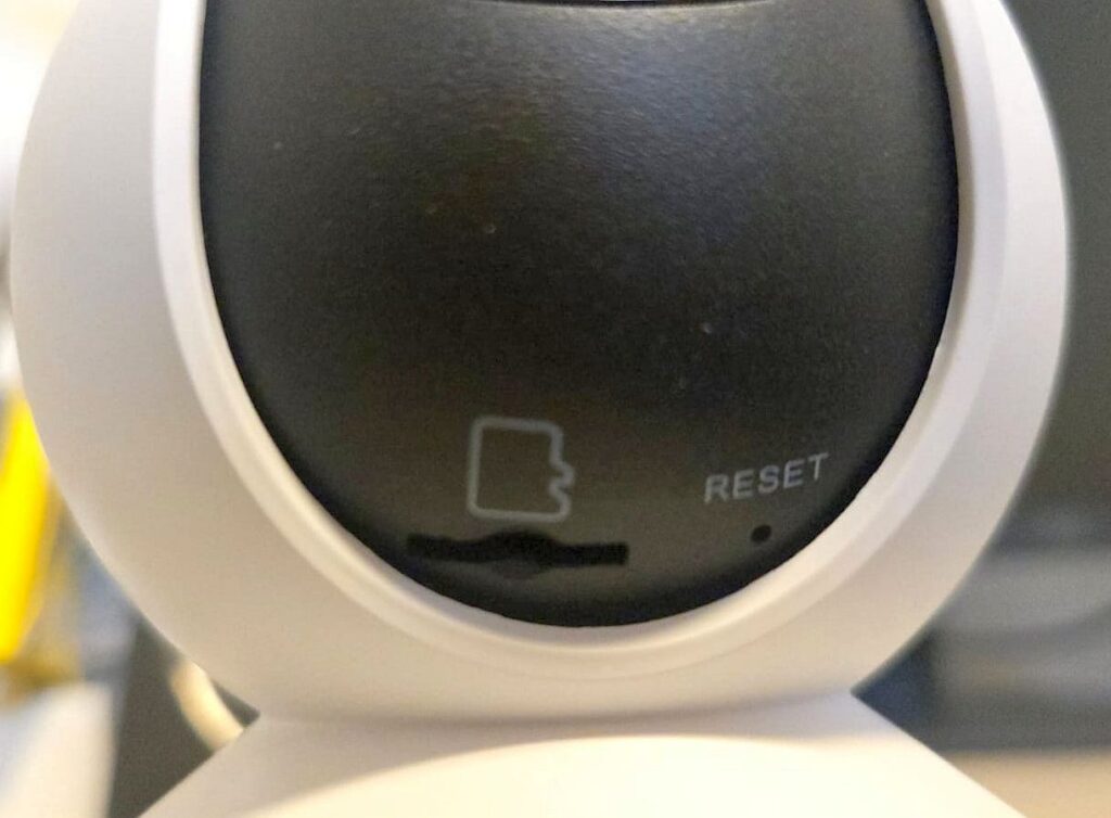 Micro SD card slot under the lens